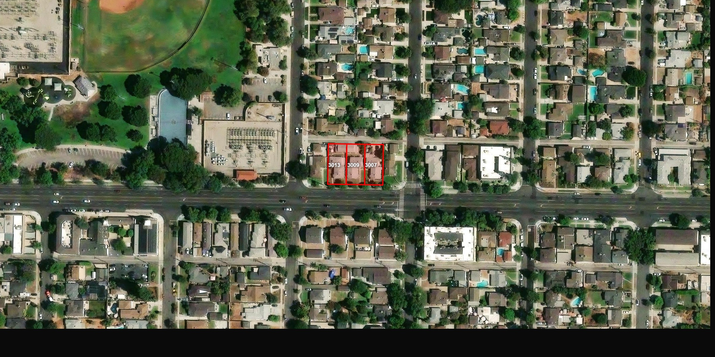 Aerial satellite view showing the three adjacent duplex parcels at 3007, 3009, and 3013 W Victory Blvd outlined in red